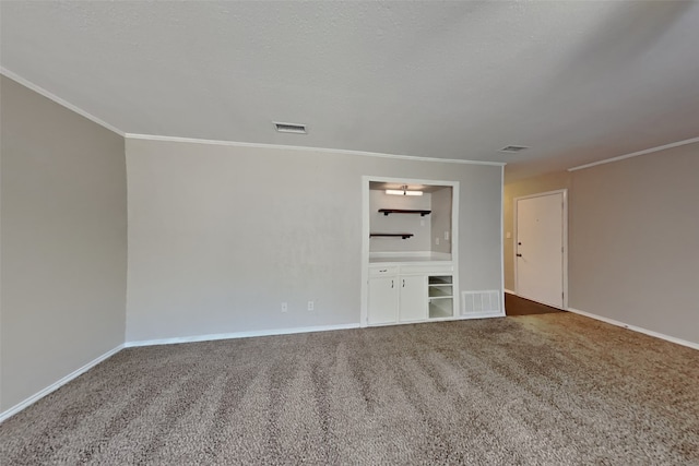 interior space featuring crown molding and a textured ceiling