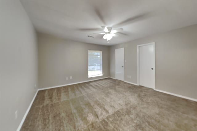 unfurnished room with carpet floors and ceiling fan