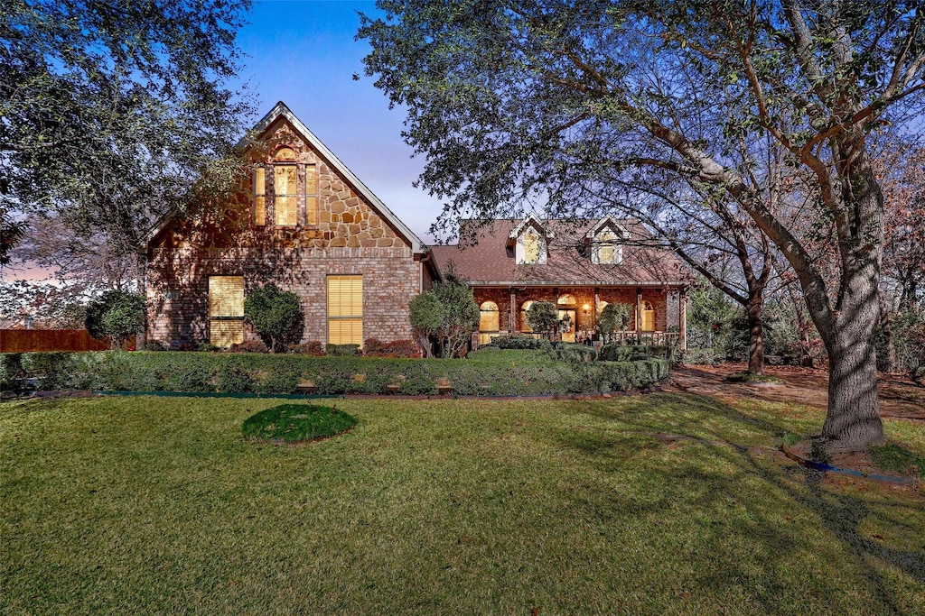 tudor house featuring a yard