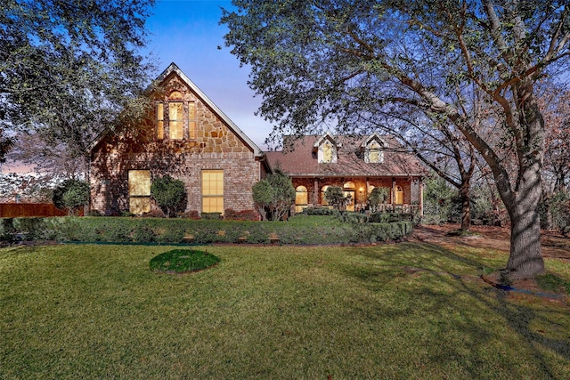 tudor house featuring a yard