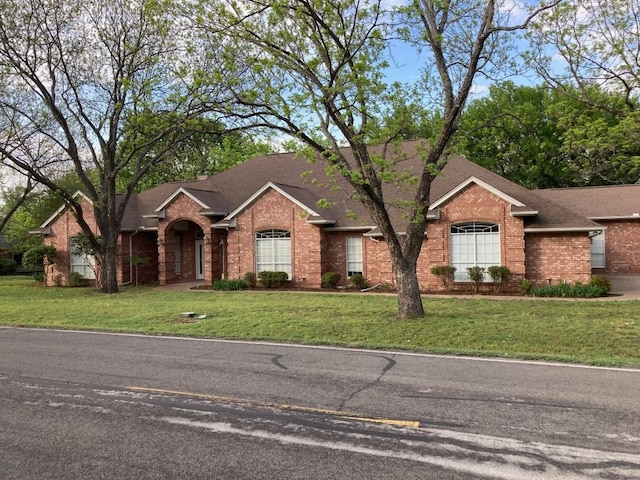 ranch-style house with a front yard