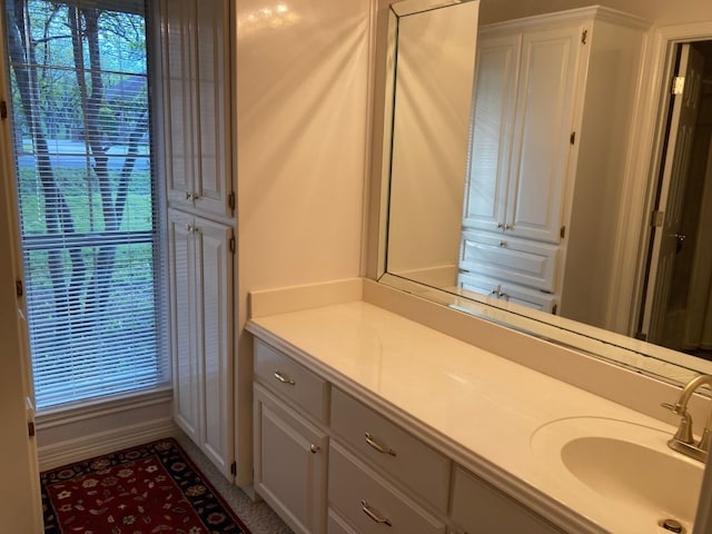 bathroom with plenty of natural light and vanity