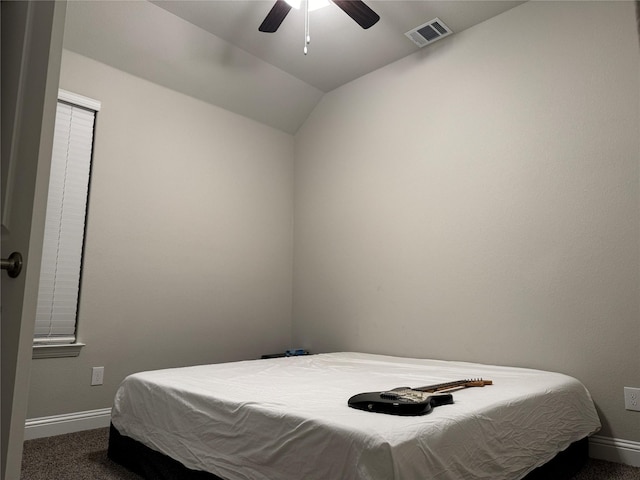 carpeted bedroom featuring lofted ceiling and ceiling fan