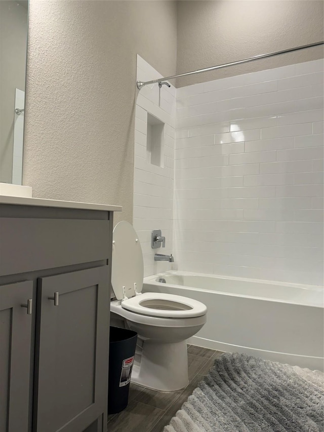 full bathroom with shower / bath combination, vanity, and toilet