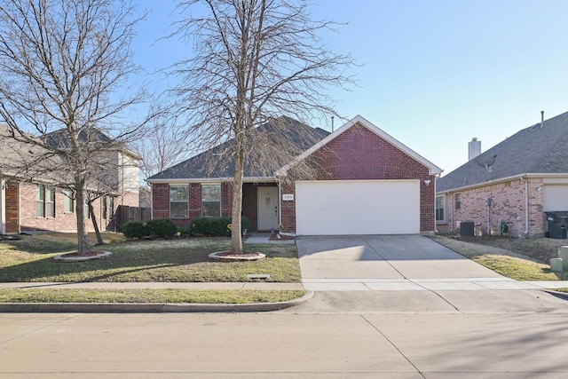 view of front of property featuring cooling unit and a garage