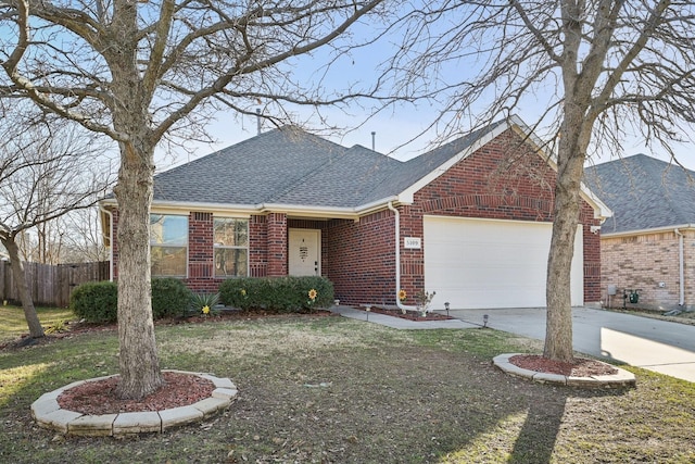 single story home with a garage and a front lawn