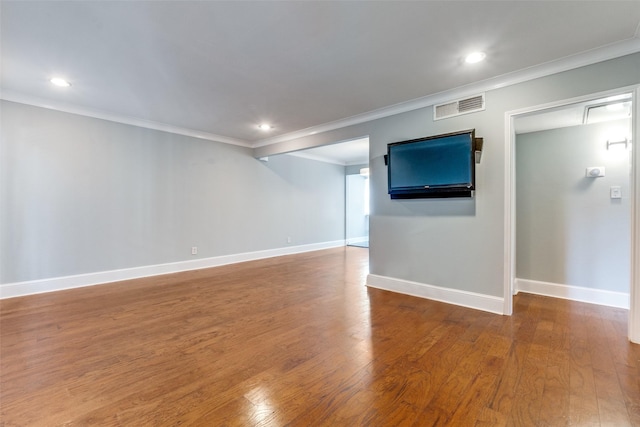 interior space with hardwood / wood-style flooring and ornamental molding