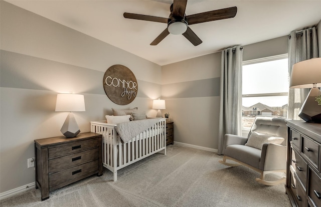 bedroom with light carpet and ceiling fan