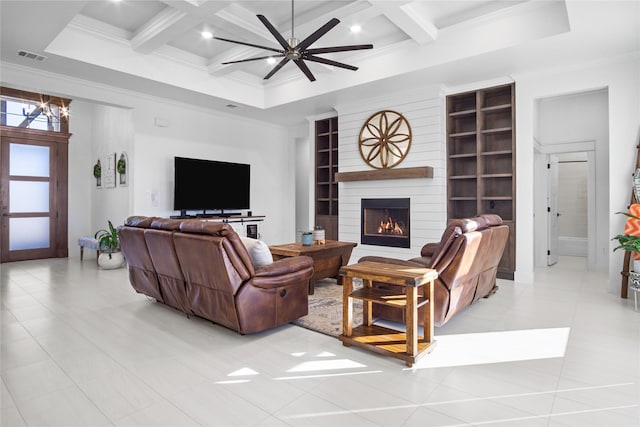 living room featuring coffered ceiling, crown molding, a fireplace, and beamed ceiling