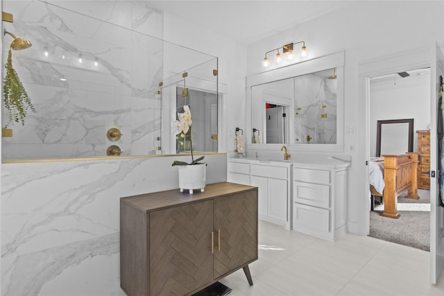 bathroom with vanity and tiled shower