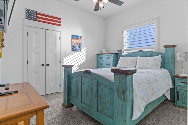 carpeted bedroom with ceiling fan and a closet