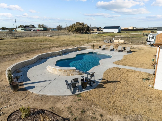 view of pool with a yard and a patio area