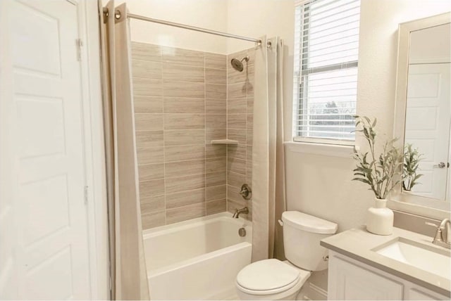 full bathroom with shower / bathtub combination with curtain, vanity, and toilet