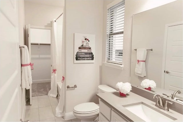 full bathroom with vanity, toilet, tile patterned flooring, and shower / bath combo