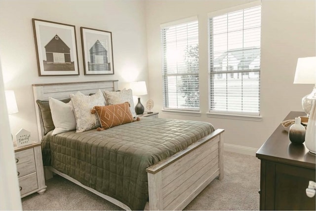 bedroom featuring light carpet