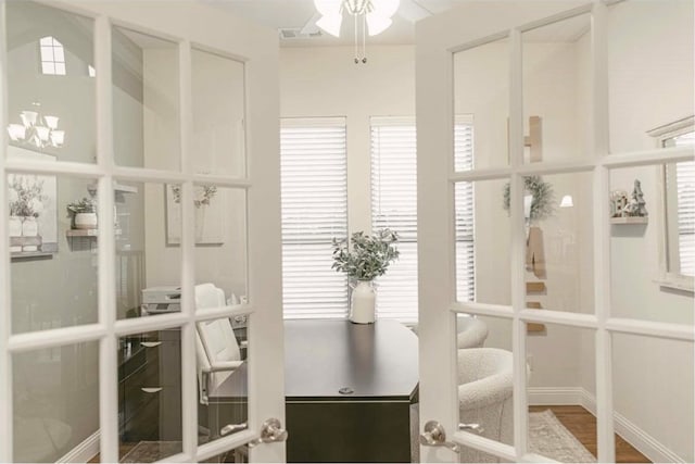 interior space featuring wood-type flooring and french doors