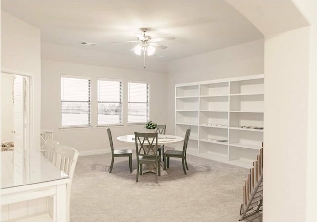 dining room featuring carpet and ceiling fan