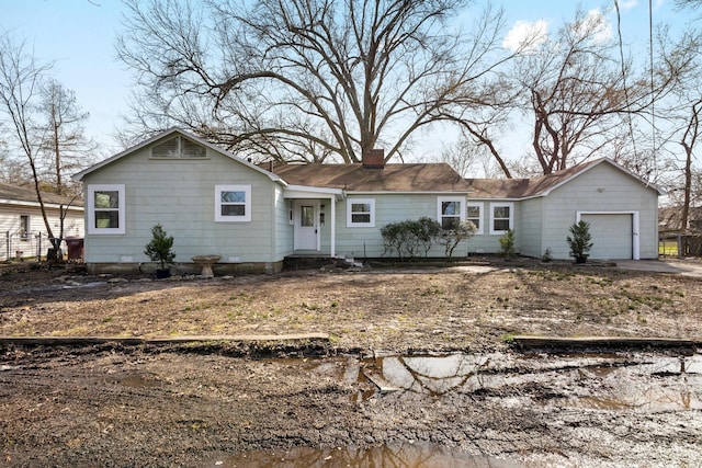 ranch-style house featuring a garage