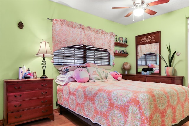 bedroom featuring ceiling fan and wood-type flooring