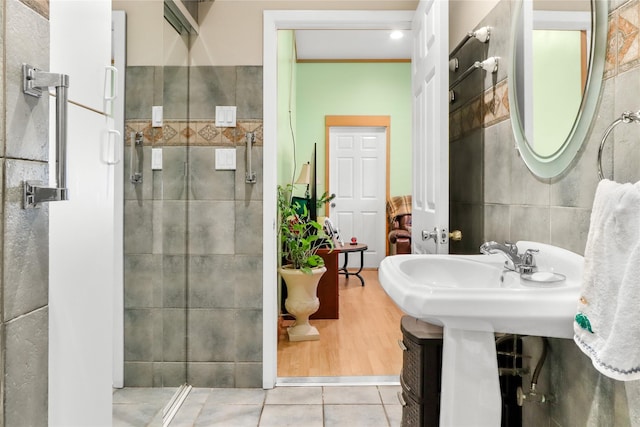 bathroom with tile patterned floors and tile walls