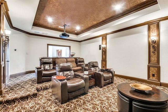 home theater room with crown molding and a raised ceiling