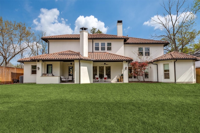 rear view of house with a yard, central AC, a patio, and ceiling fan