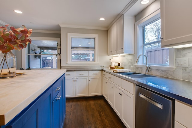 kitchen with white cabinetry, dishwasher, sink, and blue cabinetry