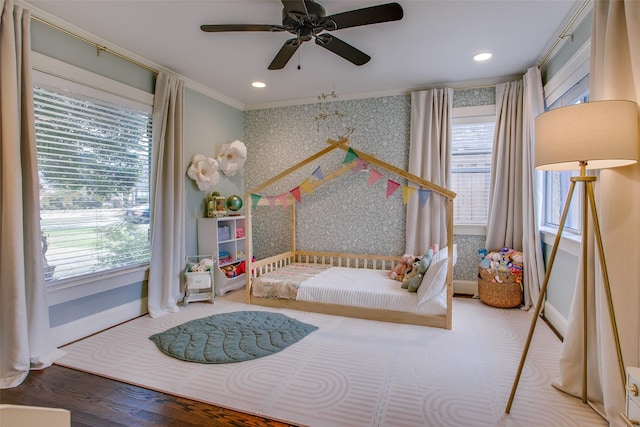 bedroom with crown molding and ceiling fan