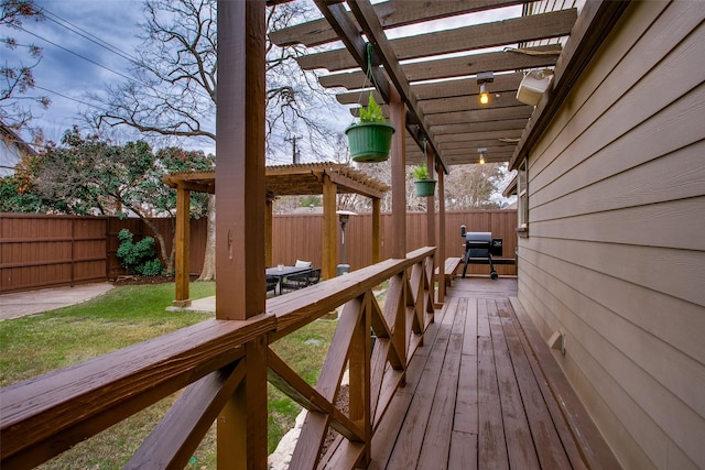 deck featuring a yard and a pergola