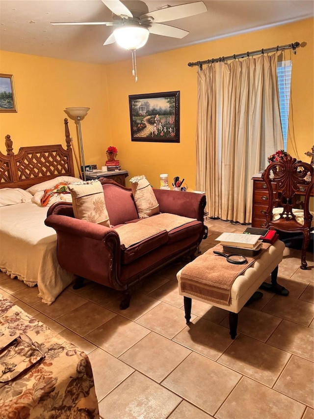 living room featuring light tile patterned floors and ceiling fan