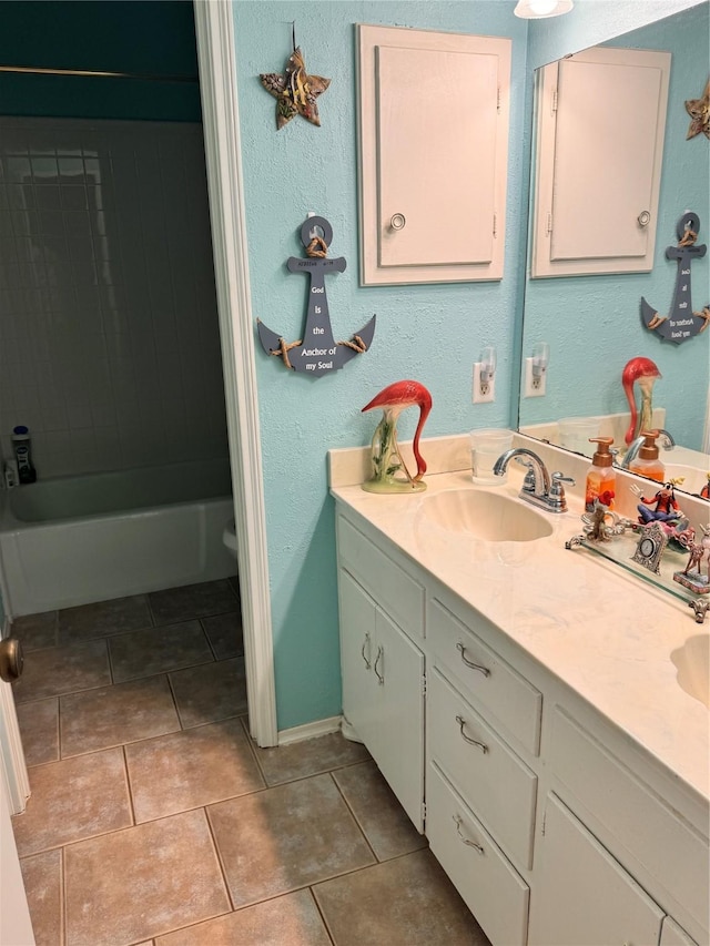 bathroom featuring vanity, tile patterned floors, and bathtub / shower combination