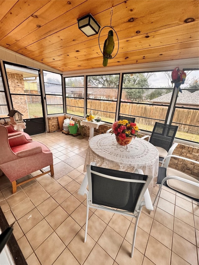 sunroom with vaulted ceiling and wooden ceiling