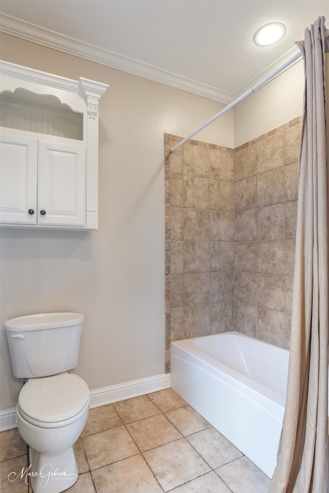 bathroom featuring toilet, tile patterned floors, ornamental molding, and shower / bathtub combination with curtain