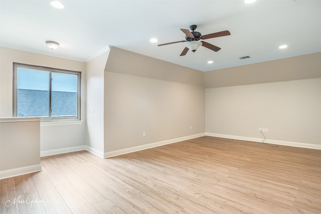 unfurnished room featuring ceiling fan and light hardwood / wood-style flooring