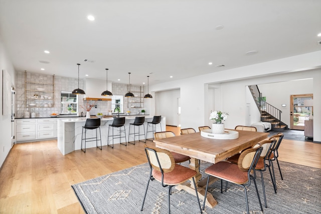 dining space featuring light wood-type flooring