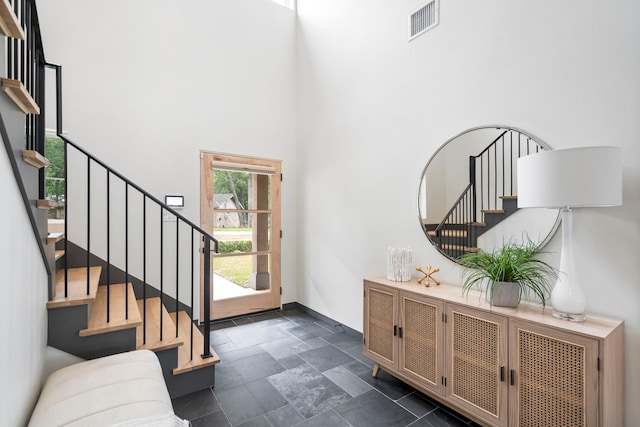 foyer entrance featuring a high ceiling