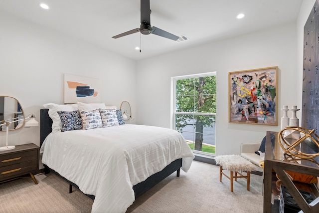 bedroom featuring ceiling fan and light colored carpet