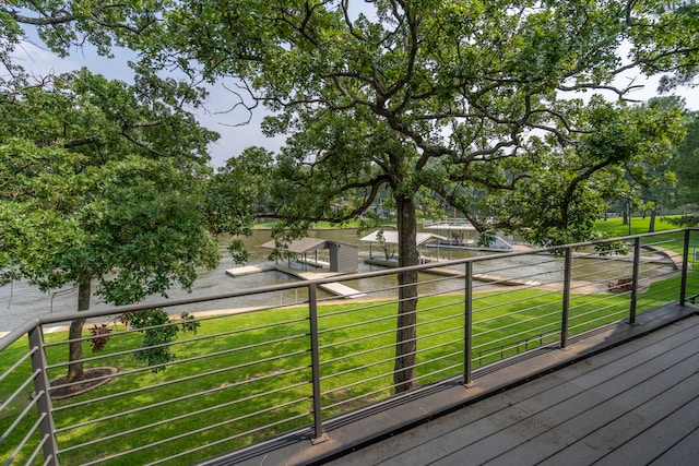 wooden terrace with a lawn