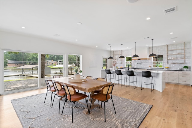 dining room with light wood-type flooring