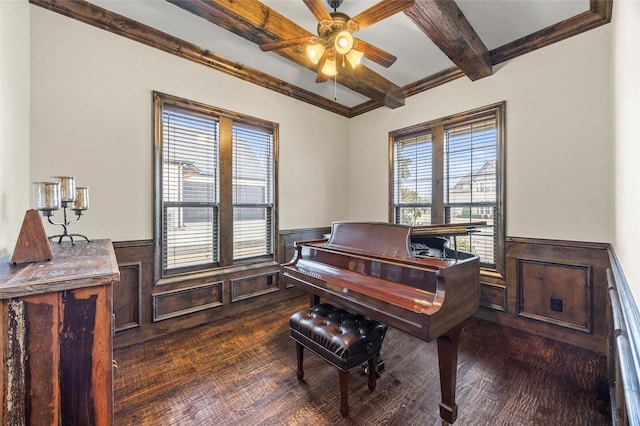 909 Reflection Ct, Heath, TX 75032 - living area with wainscoting, a ceiling fan, dark wood finished floors, and beamed ceiling
