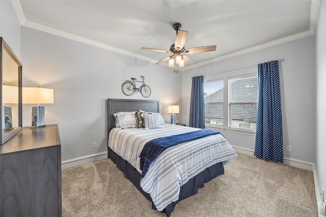 carpeted bedroom featuring ceiling fan and ornamental molding