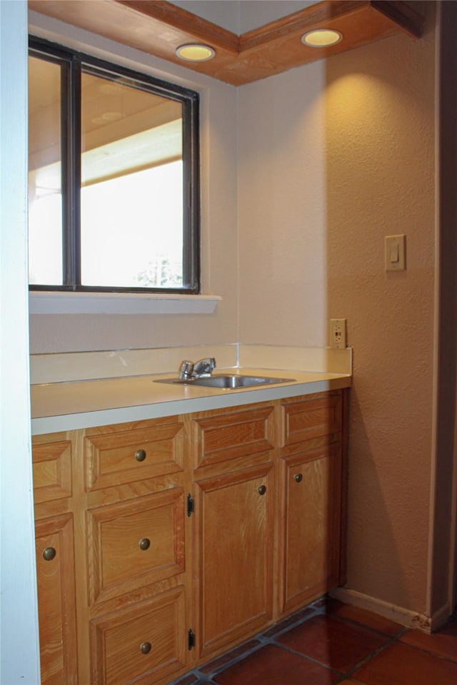 bathroom with tile patterned flooring and vanity