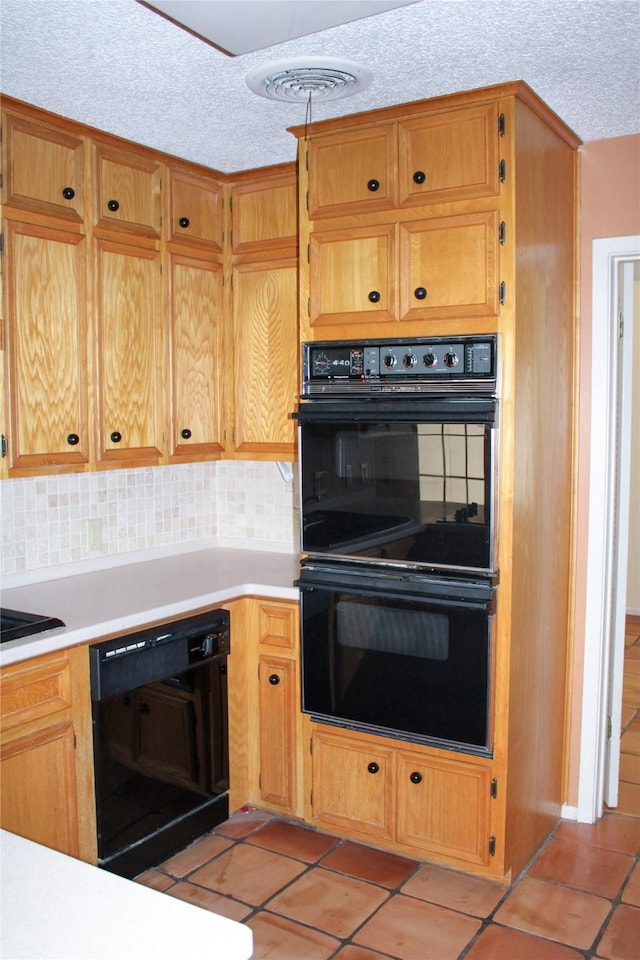 kitchen featuring backsplash, black appliances, a textured ceiling, and light tile patterned flooring