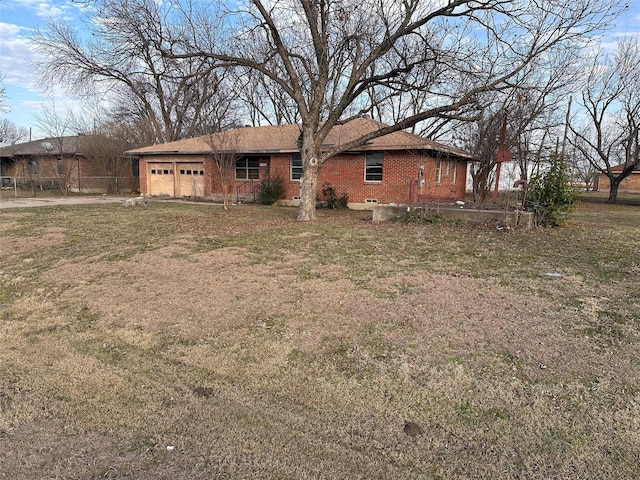 exterior space with a garage and a front yard