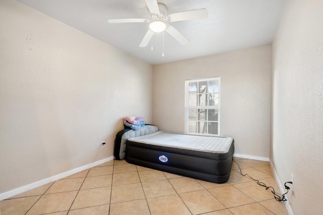 tiled bedroom with ceiling fan