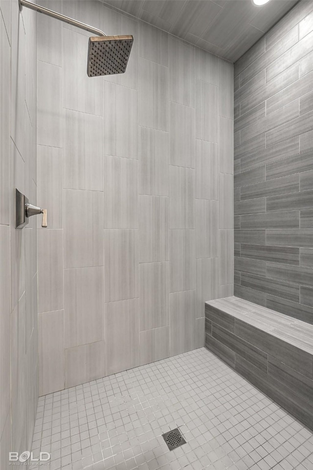 bathroom with a tile shower