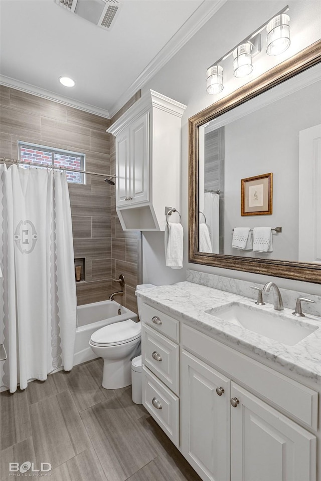 full bathroom with crown molding, shower / tub combo with curtain, vanity, and toilet