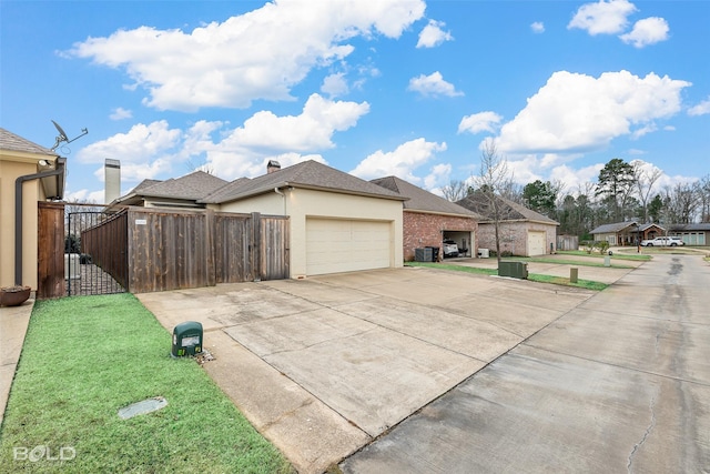 view of property exterior featuring a garage and a yard