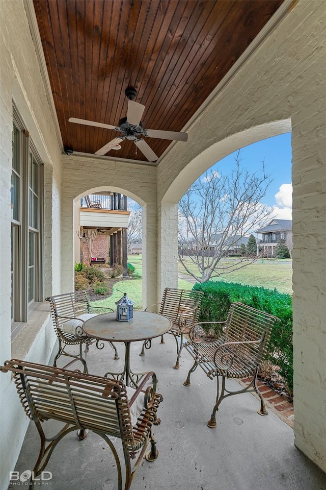 view of patio / terrace with ceiling fan and a porch