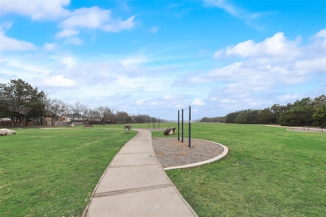 view of home's community with a yard